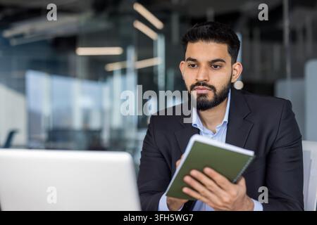 Professional businessman working in a modern office environment. Stock Photo