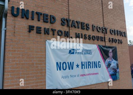 Brick post office building in Fenton, Missouri with postal service signs and a now hiring banner, showing local jobs and public services. Stock Photo