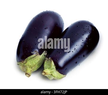 Two ripe eggplants with water drops isolated on white Stock Photo