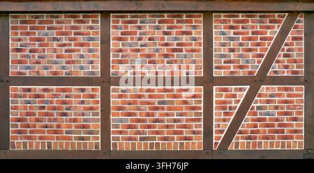 Half-timbered - brown beams filled with red patterned bricks Stock Photo