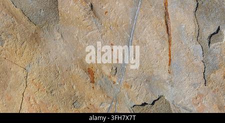 Natural Rock Texture with Weathered Surface and Mineral Veins Stock Photo