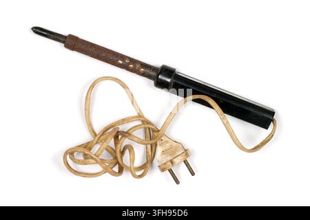 Old electric soldering iron with wire on white background. Close-up of soldering iron. Stock Photo