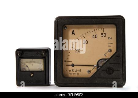 Old ammeters. Devices for measuring current on a white background. Stock Photo