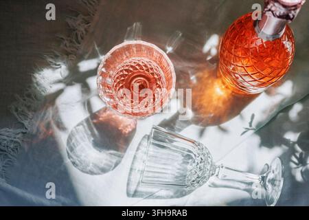 Luxury rose Champagne Still Life with Crystal Glasses and Bottle Stock Photo
