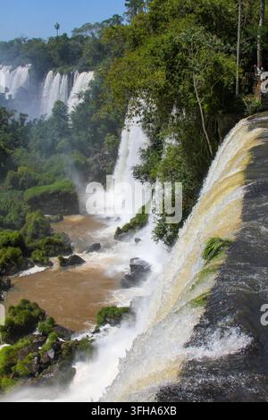 Water cascades over the cliffs of Iguazu Falls in Foz do Iguacu, Brazil ...