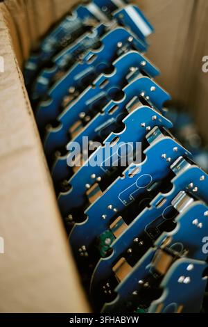 Circuit Boards Stored in Cardboard Box for Hardware Manufacturing Stock Photo