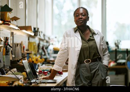 Portrait of Black Female Engineer Standing in Electronics Laboratory Stock Photo