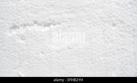 White damaged styrofoam texture background macro detail with dent and scratch full frame Stock Photo