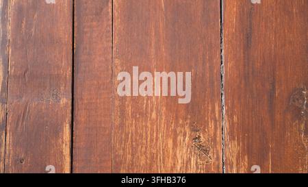 Dark brown vintage wooden wall texture background featuring vertical plank seams natural knot details and aged surface textures Stock Photo