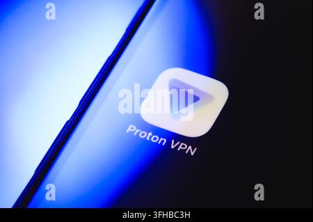 Paris, France - September 16, 2026: Proton VPN application logo displayed on a smartphone screen with blue backlighting. Stock Photo