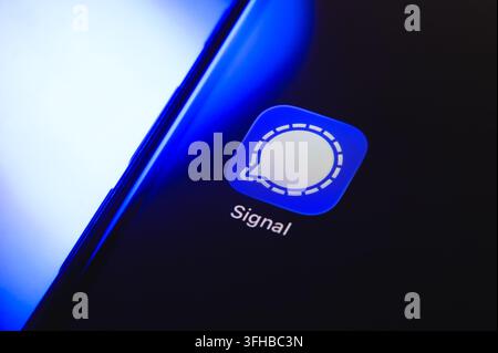 Paris, France - September 16, 2026: Signal encrypted messaging app logo displayed on a smartphone display with blue lighting. Stock Photo