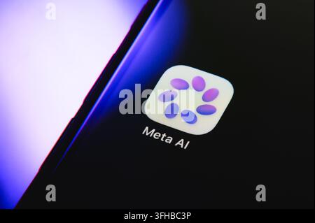 Paris, France - September 16, 2026: Meta AI assistant application logo on a smartphone screen with purple neon backlighting. Stock Photo