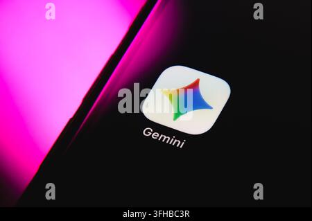 Paris, France - September 16, 2026: Google Gemini AI application logo displayed on a smartphone screen with magenta lighting. Stock Photo