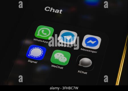 Paris, France - September 16, 2026: Smartphone display showing a folder titled Chat with messaging applications. Stock Photo