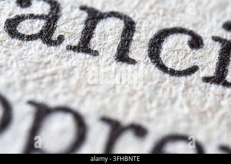 Close-up macro view of printed text on paper, highlighting the word financial from a dictionary, representing concepts of economy, banking, and busine Stock Photo
