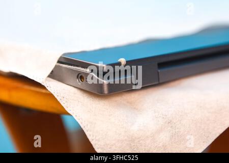 New laptop factory protective case blue background. Stock Photo