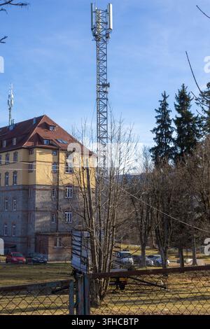 Szklarska Poreba, Poland - December 16, 2025: Close-up view of a metal cellular tower equipped with antennas, supporting advanced 5G mobile communicat Stock Photo