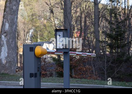 Szklarska Poreba, Poland - December 16, 2025: Automated parking barrier with video intercom and card reader, managing secure vehicle access to private Stock Photo