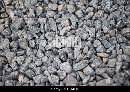 A close-up shot of grey granite crushed stone aggregate texture. Stock Photo