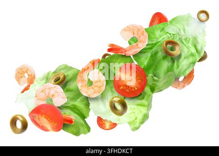 Shrimps, tomato pieces, lettuce leaves and sliced olives flying in air against white background Stock Photo