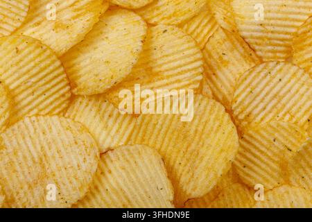 Lots of potato chips, texture close up Stock Photo