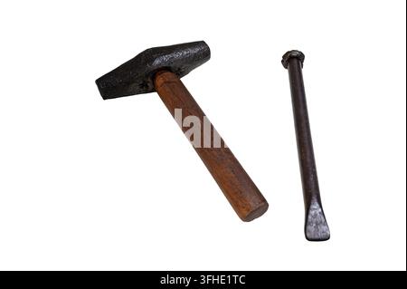 Traditional stonemason hammer and chisel hand tools, isolated on a white background. Stock Photo