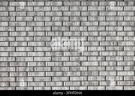 Rows of pale rectangular units sit in a staggered offset layout, each block showing faint gray shading and small pitted marks on its surface. Thin gro Stock Photo
