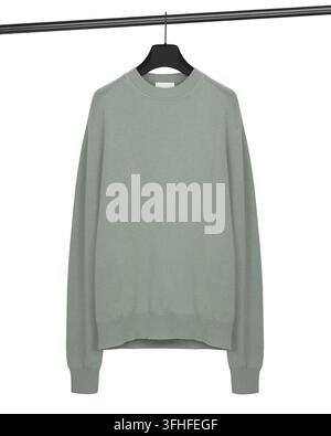 Plain sage green knitted crew neck sweater with long sleeves and ribbed cuffs hanging from a black hanger against a white background. Stock Photo