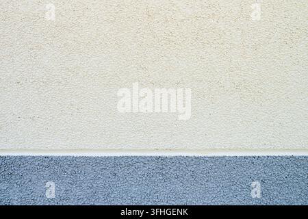 Background created from a frontal closeup of a precast concrete wall in shades of gray and cream. Hard texture. Stock Photo