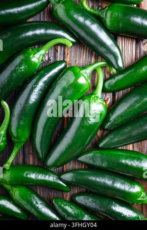 Heap of green mexican jalapeno hot peppers close up. Top view. Food photography Stock Photo