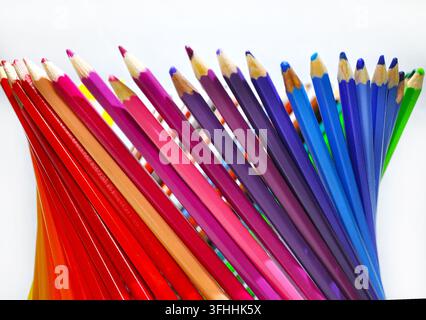 Colorful sharpened pencils arranged in a fan on a white background with ample copy space, representing creativity, drawing, education and art. Stock Photo