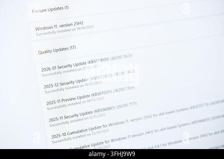 Poznan, Poland - February 15, 2026: Digital computer display showing a list of recent operating system security updates and system patches to maintain Stock Photo