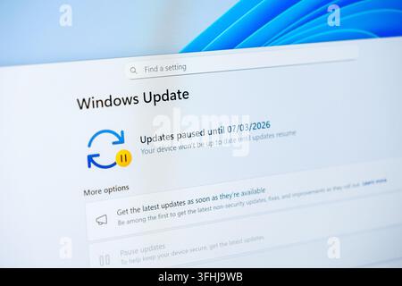 Poznan, Poland - February 15, 2026: A Microsoft Windows Update panel visible on a screen, indicating that automatic software installations are delayed Stock Photo