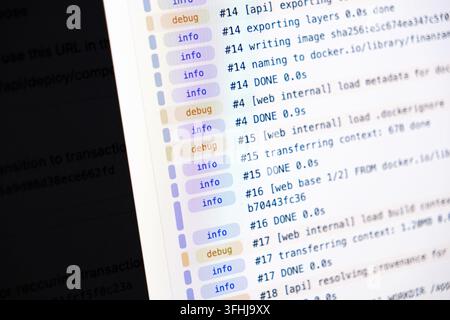 Terminal command logs running on a digital screen, highlighting automated process steps for technical developers who seek professional solutions in we Stock Photo