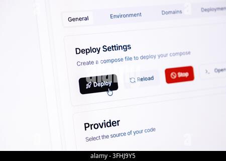 The user clicks a deploy button within a cloud control panel dashboard, illustrating seamless application release cycles, automated server management, Stock Photo