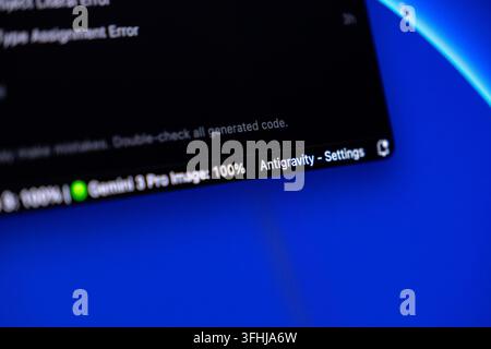 Poznan, Poland - February 9, 2026: Digital control panel displaying task status and configuration options against a vibrant blue display for technical Stock Photo