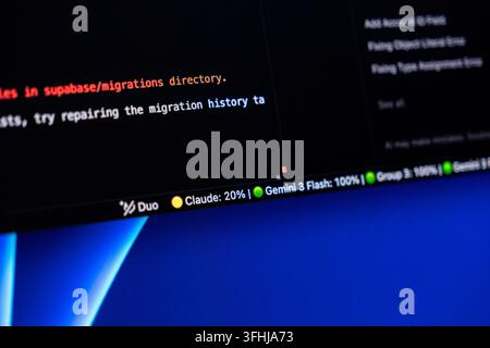 Poznan, Poland - February 9, 2026: Programmer screen displaying artificial intelligence model usage stats with bright text on a dark backdrop, reflect Stock Photo