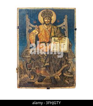 Christ pantocrator on a throne, blessing and holding an open holy book Stock Photo