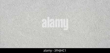White rough plaster wall surface showing abstract grainy concrete texture Stock Photo