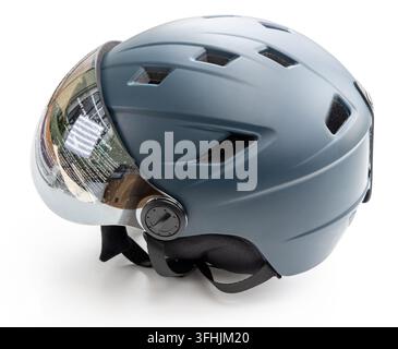 A grey protective helmet with a clear visor is shown Stock Photo