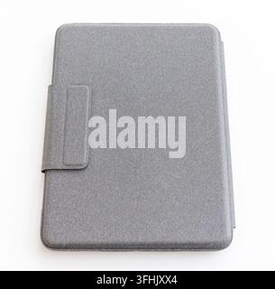 A grey textured protective case lies on a clean white background Stock Photo