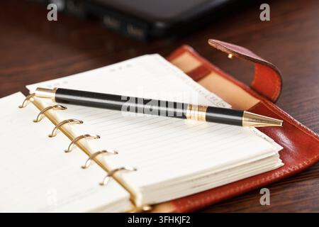 Open notebook and pen Stock Photo