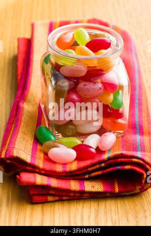 Jelly beans in glass jar Stock Photo