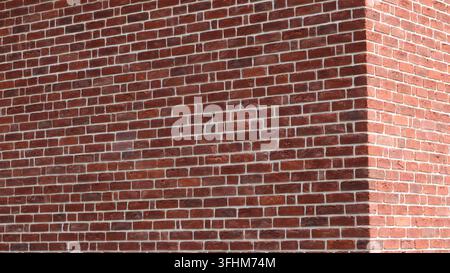 The corner of a brick building with neat masonry. The walls are made of reddish-brown brick with contrasting white mortar joints, creating a sense Stock Photo