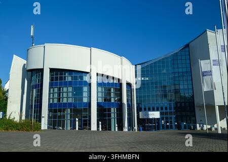 Iserlohn, Germany - August 13, 2026: Modern glass and white facade of the Universitaet Witten/Herdecke main campus building. Stock Photo
