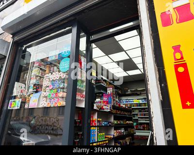 Liverpool, UK - May 16, 2026: Busy convenience store entrance showing tobacco tins, vapes, drinks and shelves of snacks in Liverpool, UK. Stock Photo