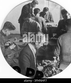 Inwalidzi, or disabled individuals, working in a tailoring workshop, 1942. Stock Photo