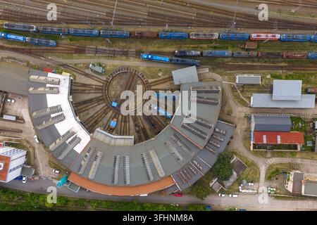 Aerial view of a railway turntable and storage tanks located near train ...