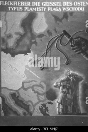 A 1942 poster presenting a map of Europe with labeled regions, including "DEUTSCHLAND" and "UKRAINE", and a large hand holding a whip with multiple thorny ends, with a figure in dark clothing and a stylized bird in flight in the background. Stock Photo