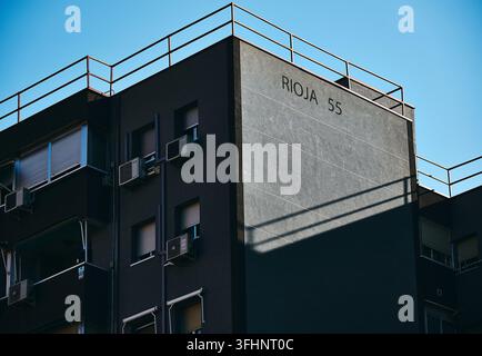 Modern residential building facade with geometric architecture and shadow patterns and sunrise in Leganés, Madrid, Spain Stock Photo